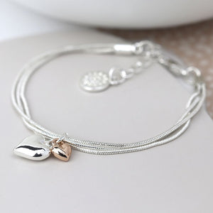 Silver Plated Triple Chain Bracelet with a Silver Plated Heart and a Rose Gold Heart