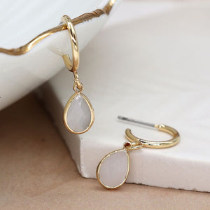 Golden hoop and white crystal drop earrings