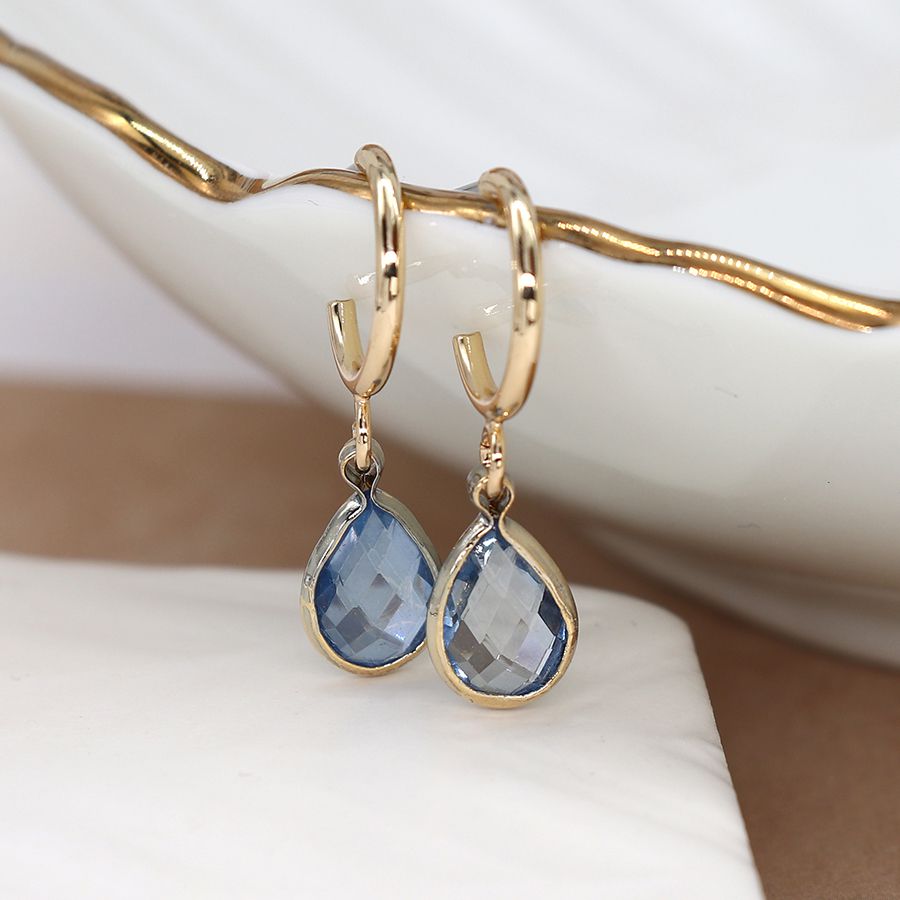 Golden hoop and blue crystal drop earrings