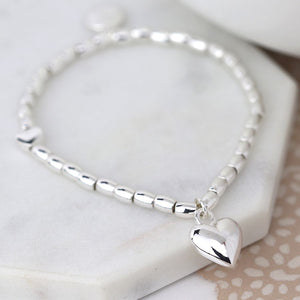 Stretch Bracelet Made With Silver Plated Oval Beads