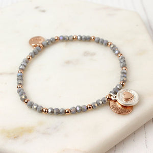 Stretch grey and rose gold plated bracelet.