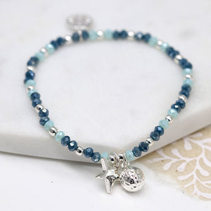 Silver plated and blue bead bracelet with star and ball