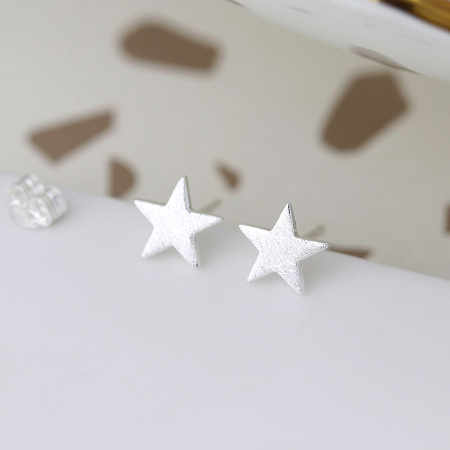 Sterling silver scratched star earrings