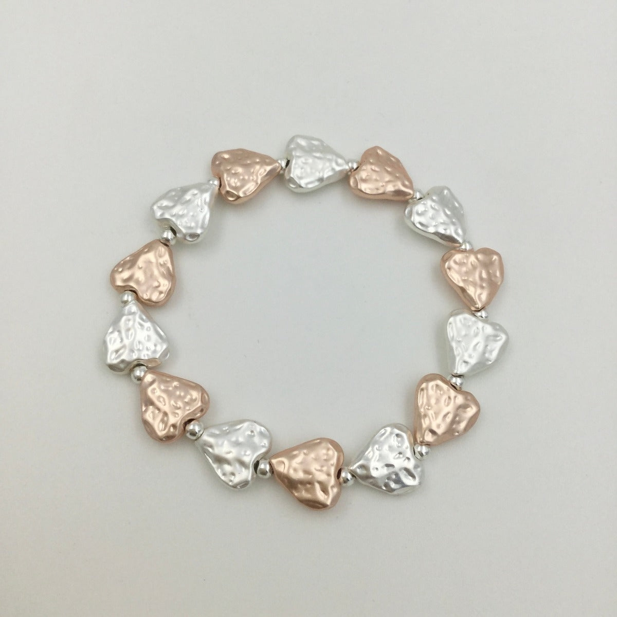 Hammered heart silver and rose gold bracelet